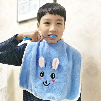 Child brushing teeth while wearing a soft blue cartoon rabbit bib, ideal for 3-8 years old kids.