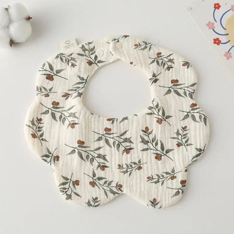 Floral-patterned newborn baby bib made of soft cotton, perfect for feeding and drooling, suitable for infants.