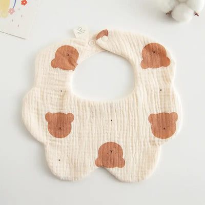 Adorable floral-shaped baby bib with bear prints, perfect for feeding and drool protection for infants.