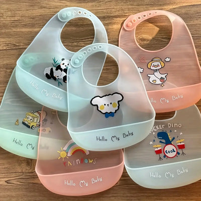 Collection of cute silicone baby bibs with cartoon prints, perfect for kids' feeding, adjustable for 1-3 years.