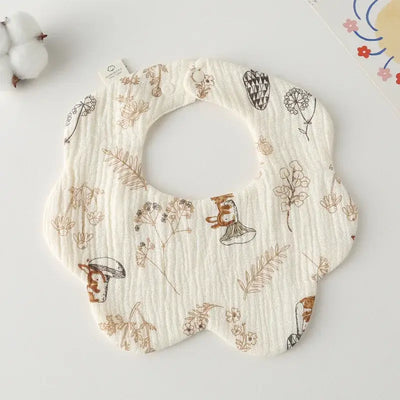 Floral-patterned cotton newborn baby bib, ideal for feeding and drooling. Stylish and functional toddler accessory.