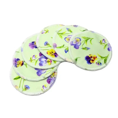 Set of 6 washable nursing pads with floral design in soft bamboo fiber for breastfeeding mothers.