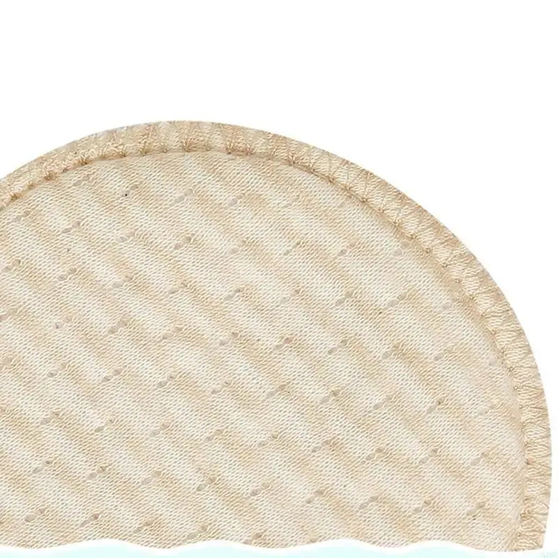 Close-up of a soft, absorbent cotton nursing breast pad, ideal for breastfeeding mothers.