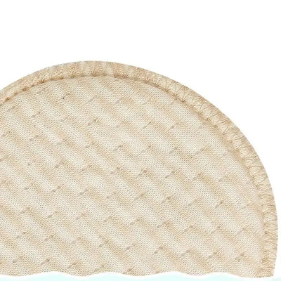 Close-up of a soft, absorbent cotton nursing breast pad, ideal for breastfeeding mothers.