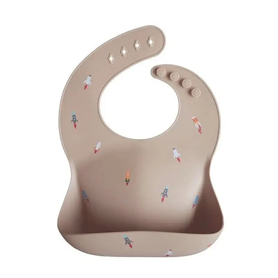 Cute silicone baby bib with rocket print, adjustable design for toddlers, waterproof and easy to clean.