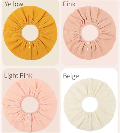Colorful baby bibs in yellow, pink, light pink, and beige, showcasing soft cotton and breathable design for infants.