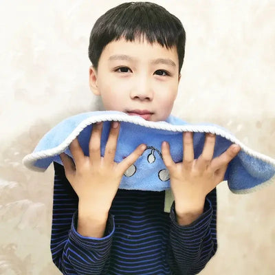 Young boy holding a soft blue towel, ideal for kids aged 3-8 for washing face and brushing teeth.