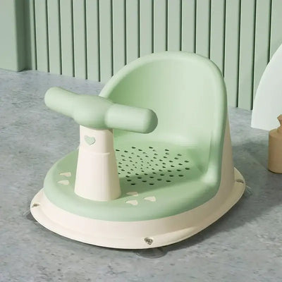 Baby bathtub seat in green, featuring suction cup design for safety, suitable for newborns and children 6-18 months.