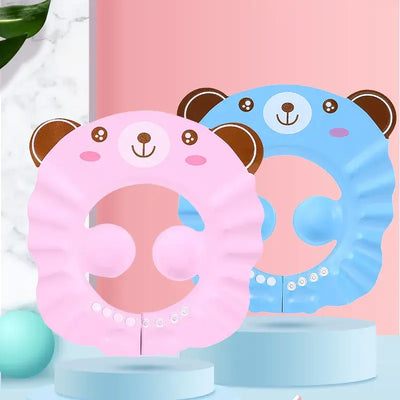 Baby shower soft cap in pink and blue bear design for kids, adjustable and protective for shampoo and bathing.