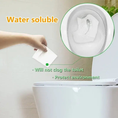 Eco-friendly water soluble disposable toilet seat cover being placed in a toilet bowl.