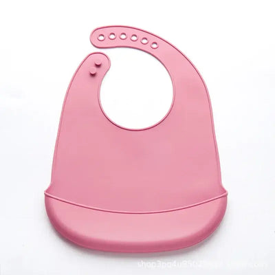 Soft pink adjustable waterproof silicone baby bib designed for drooling and feeding ease.