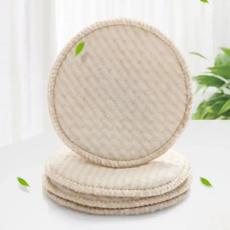 Soft and absorbent reusable nursing breast pads in a circular shape, perfect for breastfeeding mothers.