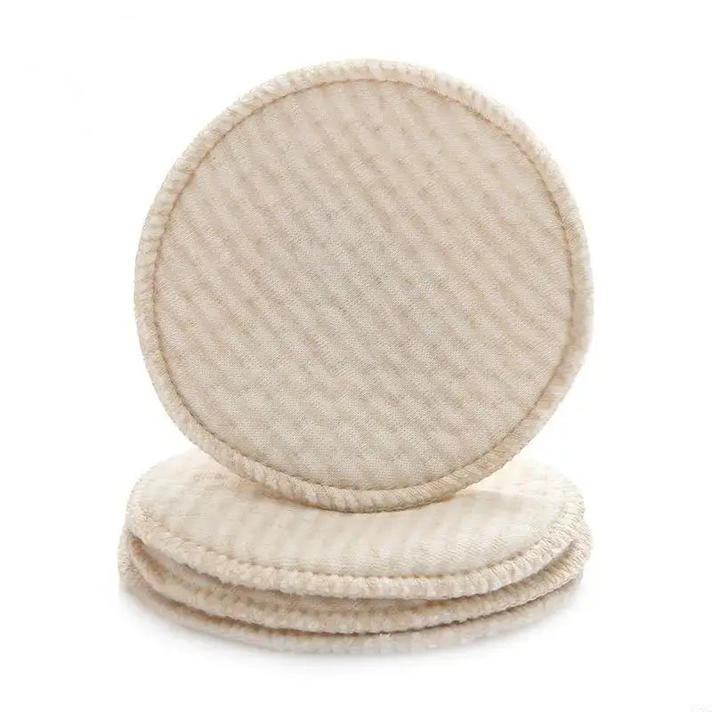 Set of four reusable nursing breast pads made from soft cotton blend, ideal for breastfeeding mothers.