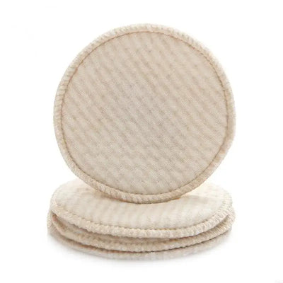 Set of four reusable nursing breast pads made from soft cotton blend, ideal for breastfeeding mothers.