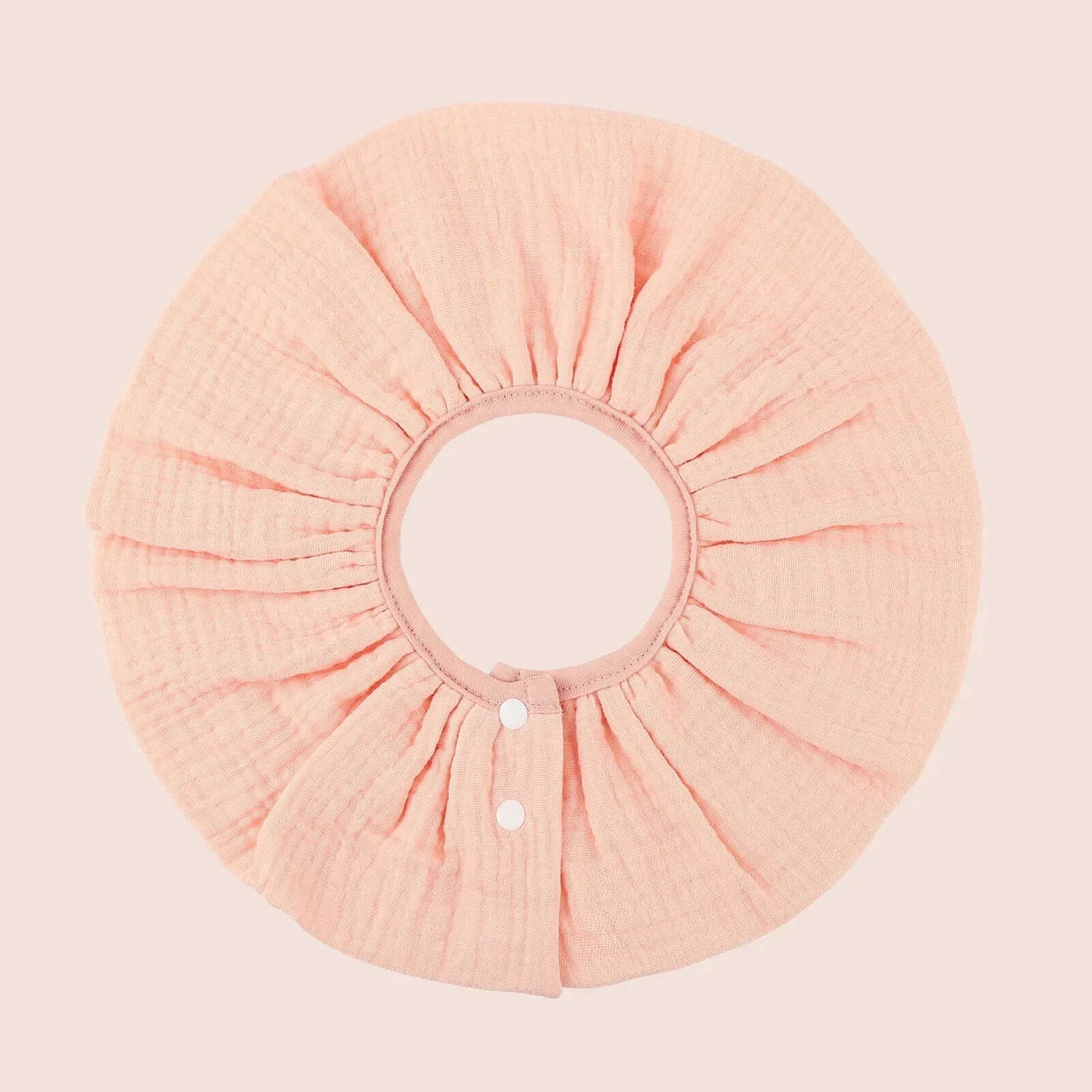 INSULAR absorbent cotton baby bib in soft peach with button closure, perfect for infants 0-1Y.