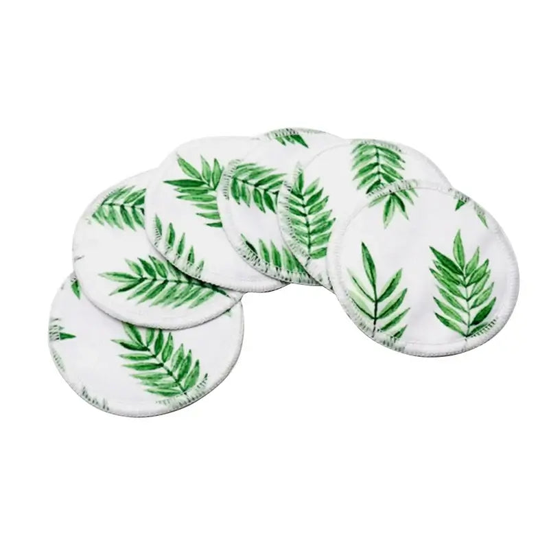 Set of 6 washable nursing pads with green leaf print, made of bamboo fiber for breastfeeding moms.