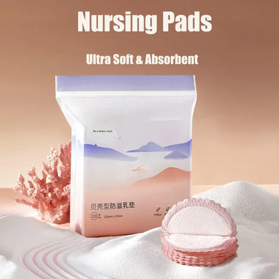 Packaging of ultra soft and absorbent nursing pads displayed on a soft surface.