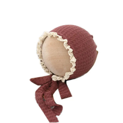Cute newborn photography prop hat in maroon with lace trim, perfect for baby costumes and photo shoots.