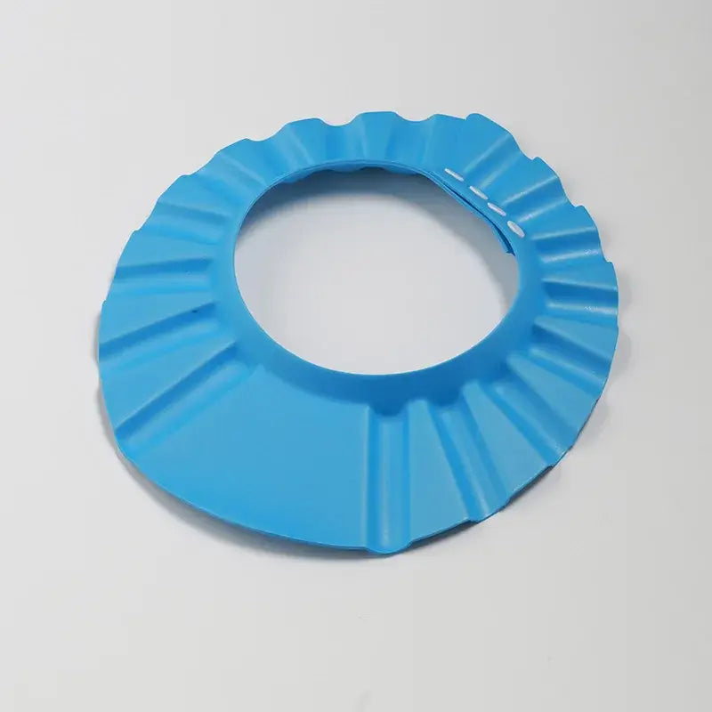 Baby shower soft cap in blue, adjustable design for children, protects ears during shampooing and bathing.
