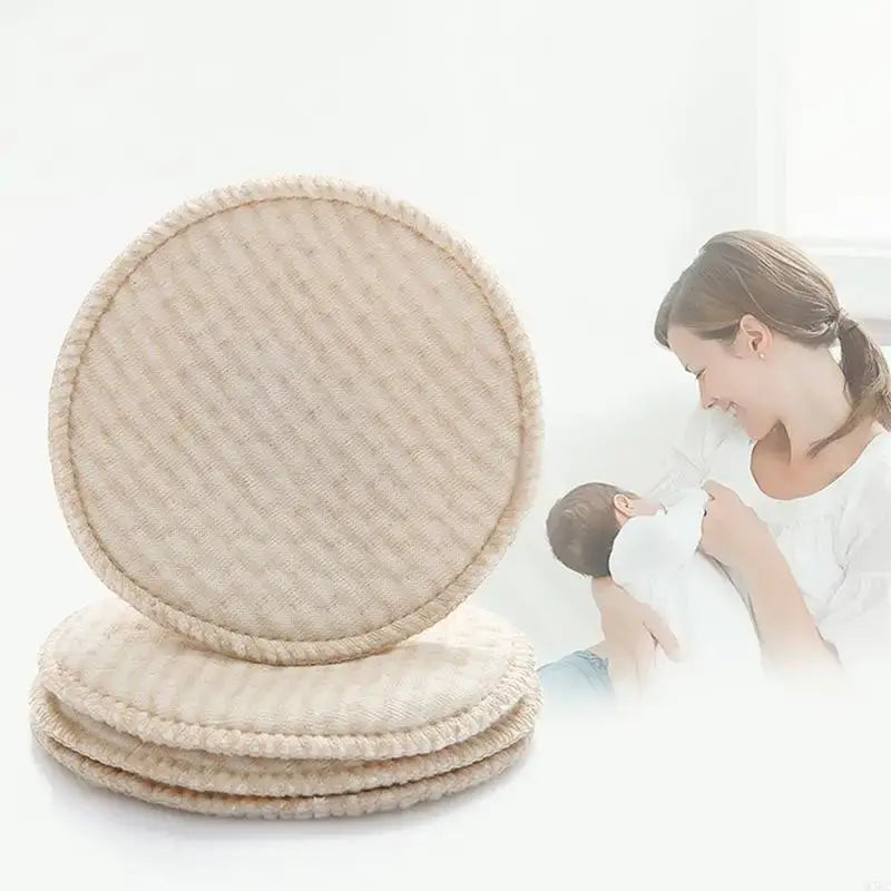 4 reusable nursing breast pads made of soft cotton blend, ideal for comfortable breastfeeding.